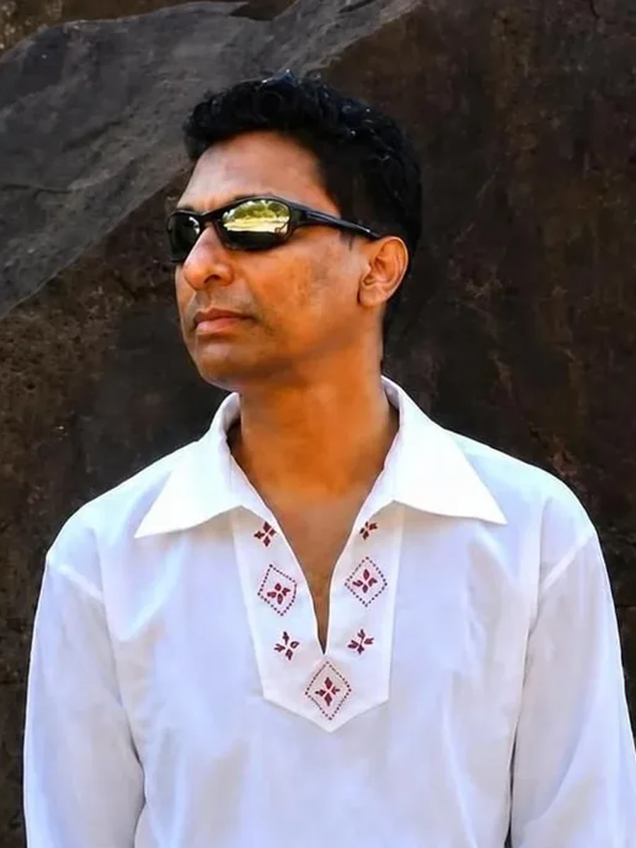 Behleem in front of dark lava rock